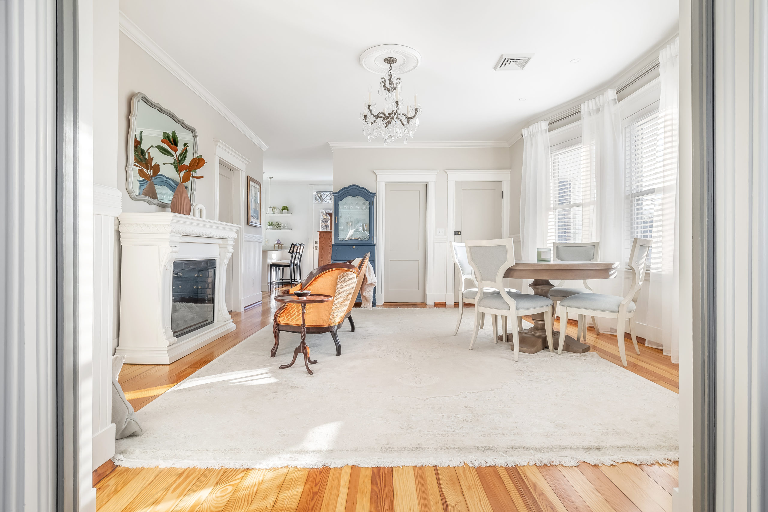 The dining room and seating area viewed from the living room doorway.